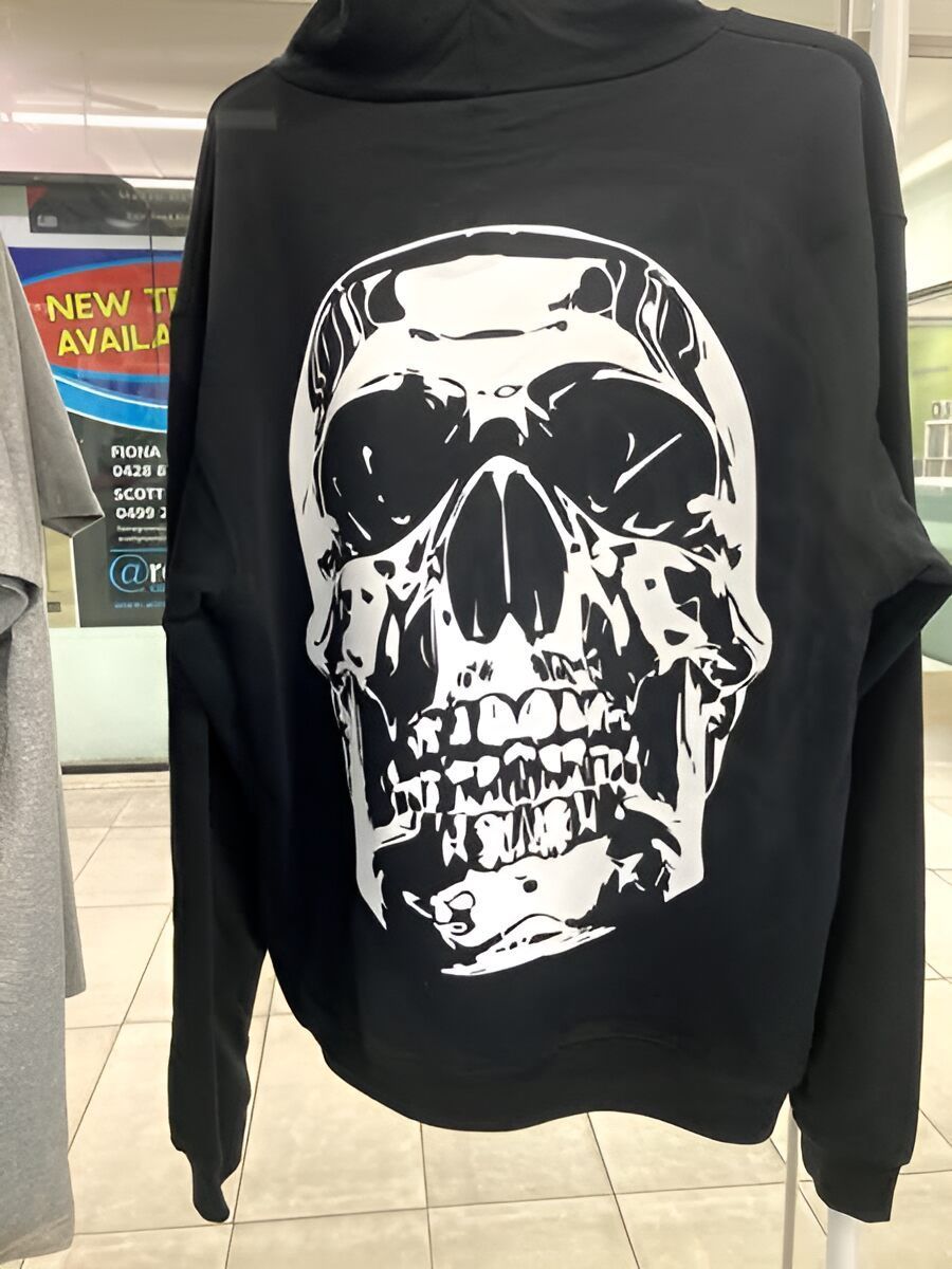 A Black Hoodie With A White Skull On The Back — Cairns Custom T-Shirts In Cairns City, QLD