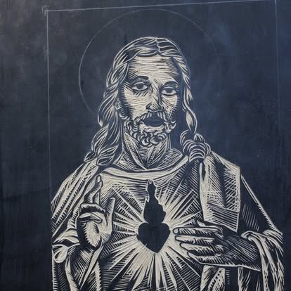 A black and white drawing of jesus holding a heart — Cairns Custom T-Shirts In Cairns City, QLD