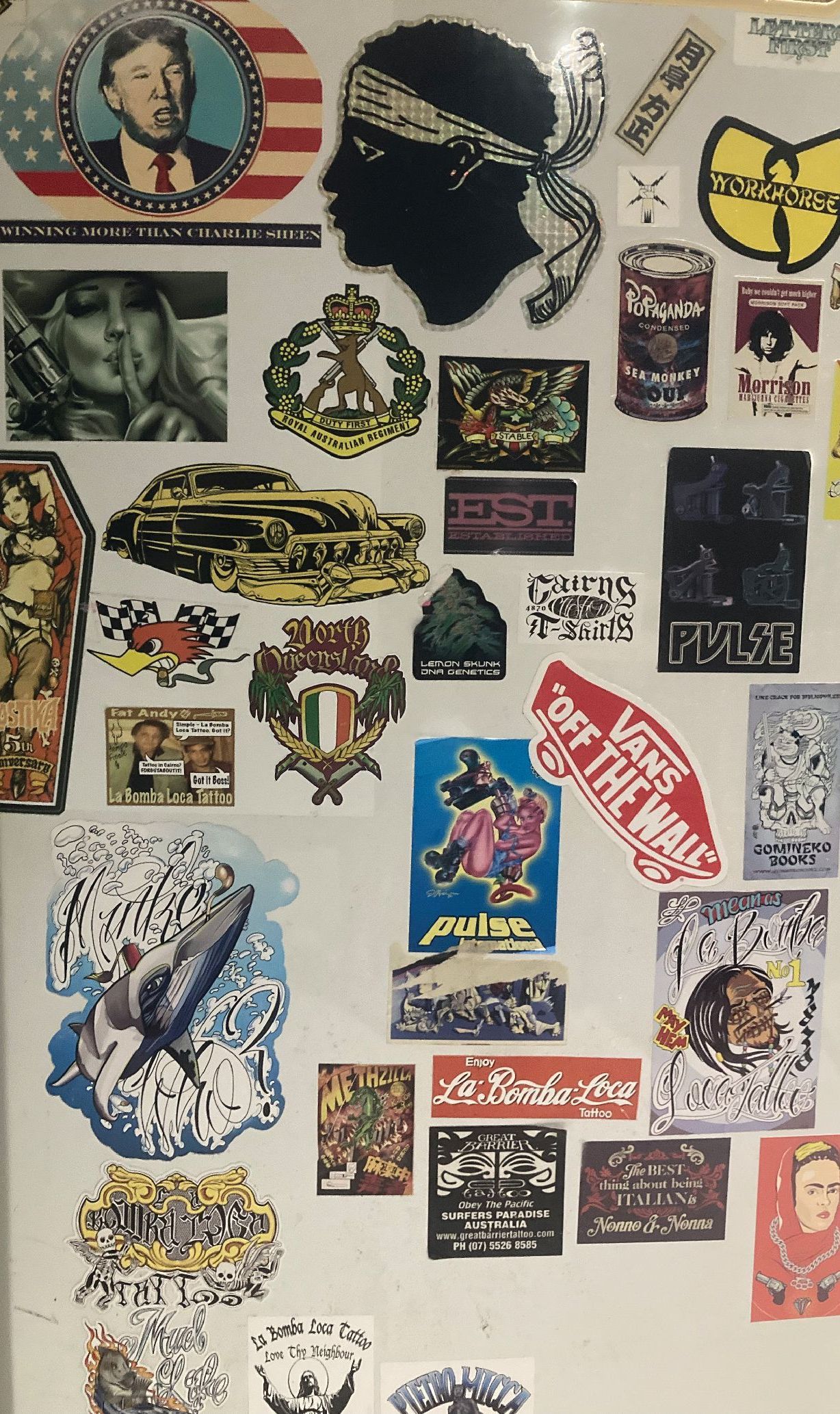 A Bunch Of Stickers On A Table That Say Good Maroon — Cairns Custom T-Shirts In Cairns City, QLD