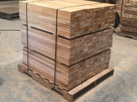 bundles of milled lumber boards
