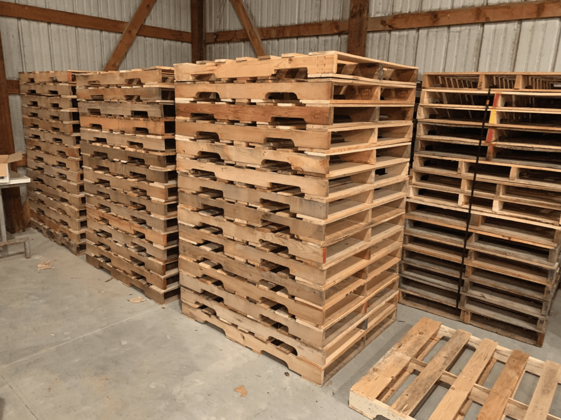 multiple stacks of wooden pallets
