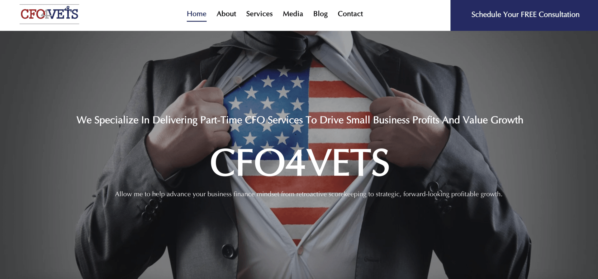 A man in a suit and tie is holding an american flag under his jacket.