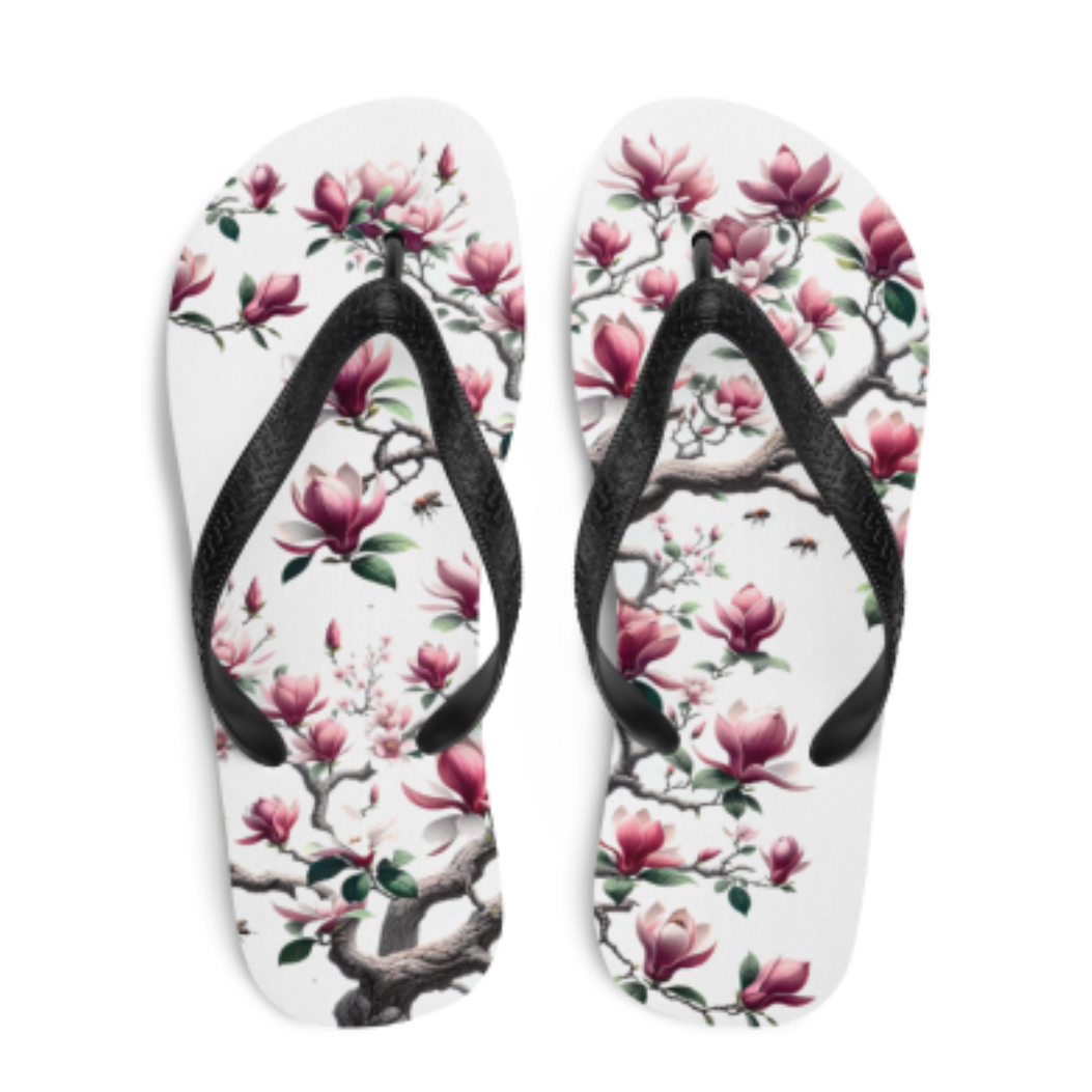 A pair of flip flops with pink flowers on them