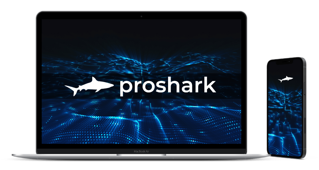 A laptop and a cell phone with the proshark logo on them.