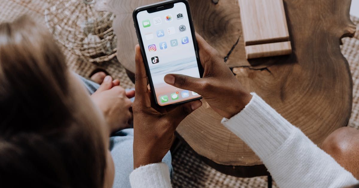 A person is holding a cell phone in their hand.