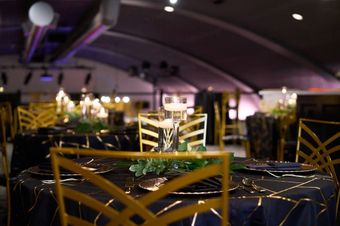 A table and chairs are set for a wedding reception.