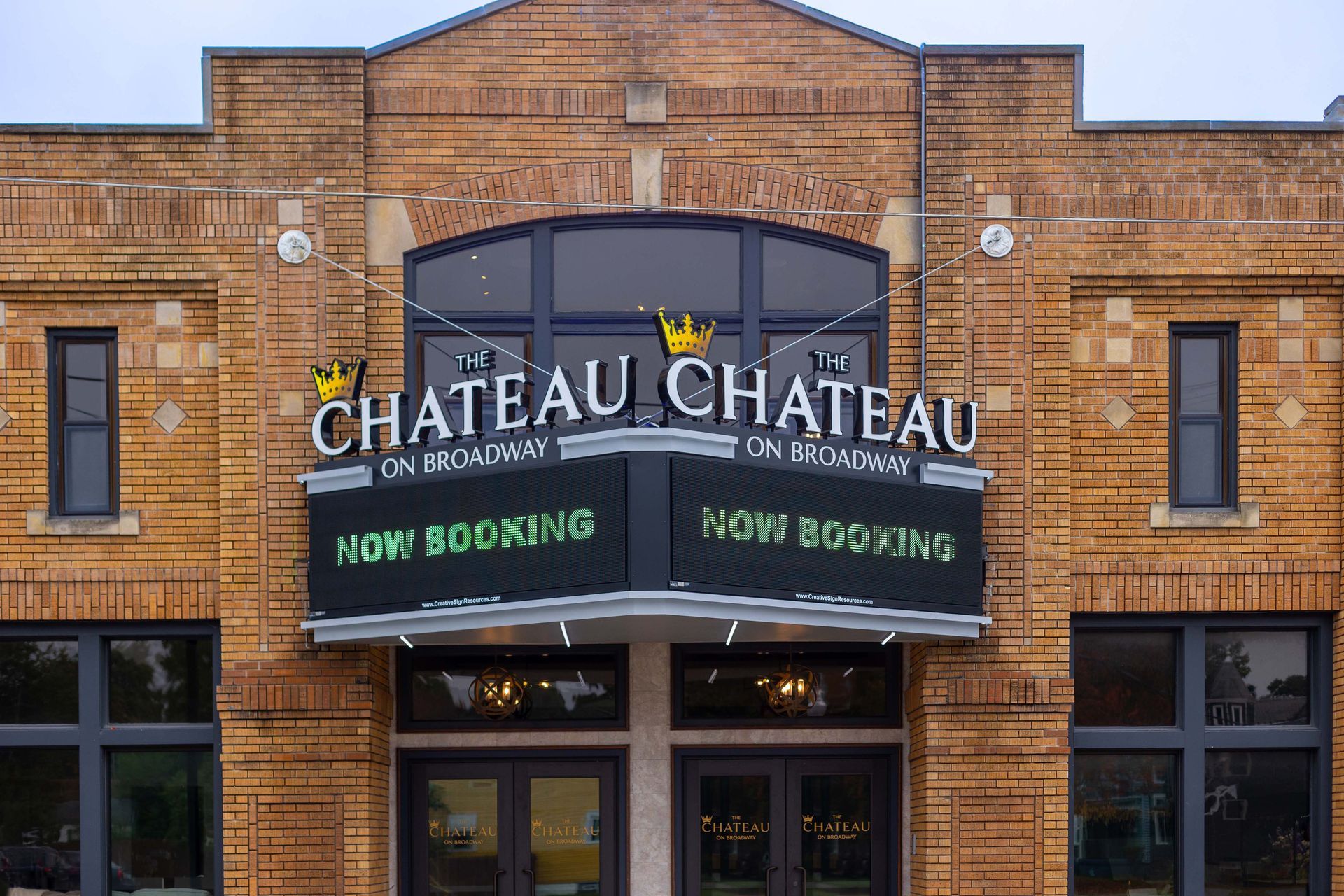 A brick building with a sign that says chateau chateau