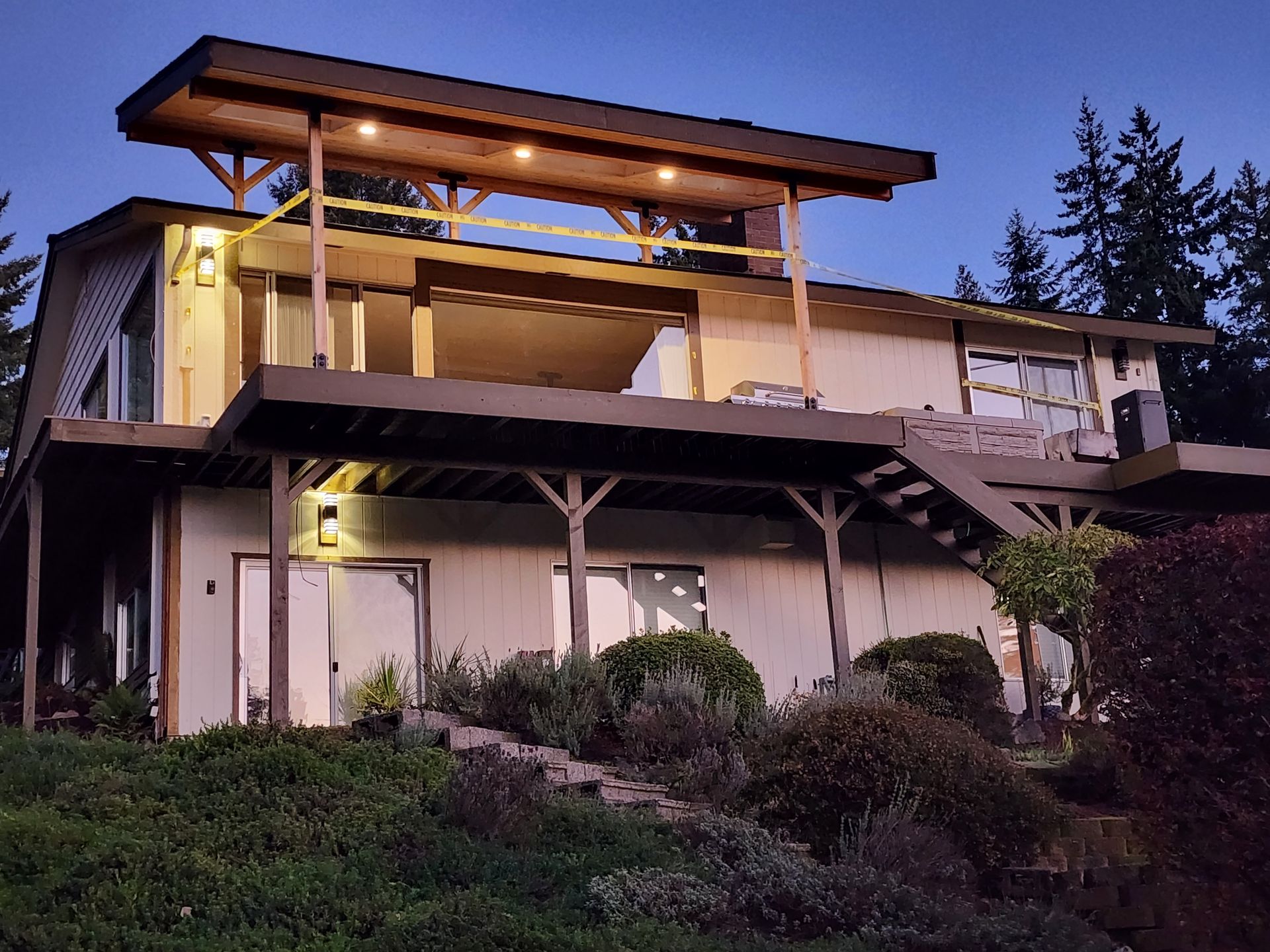 A house is being built on a hill with a large deck