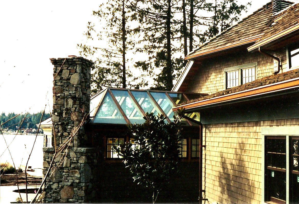A house with a chimney on the side of it.