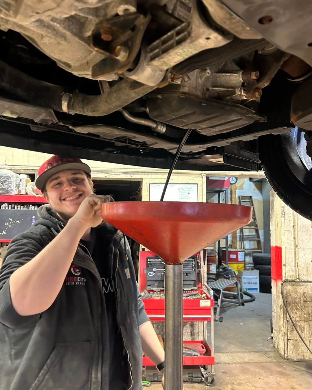 Mechanic Doing Oil Maintenance | Tire City Auto Repair