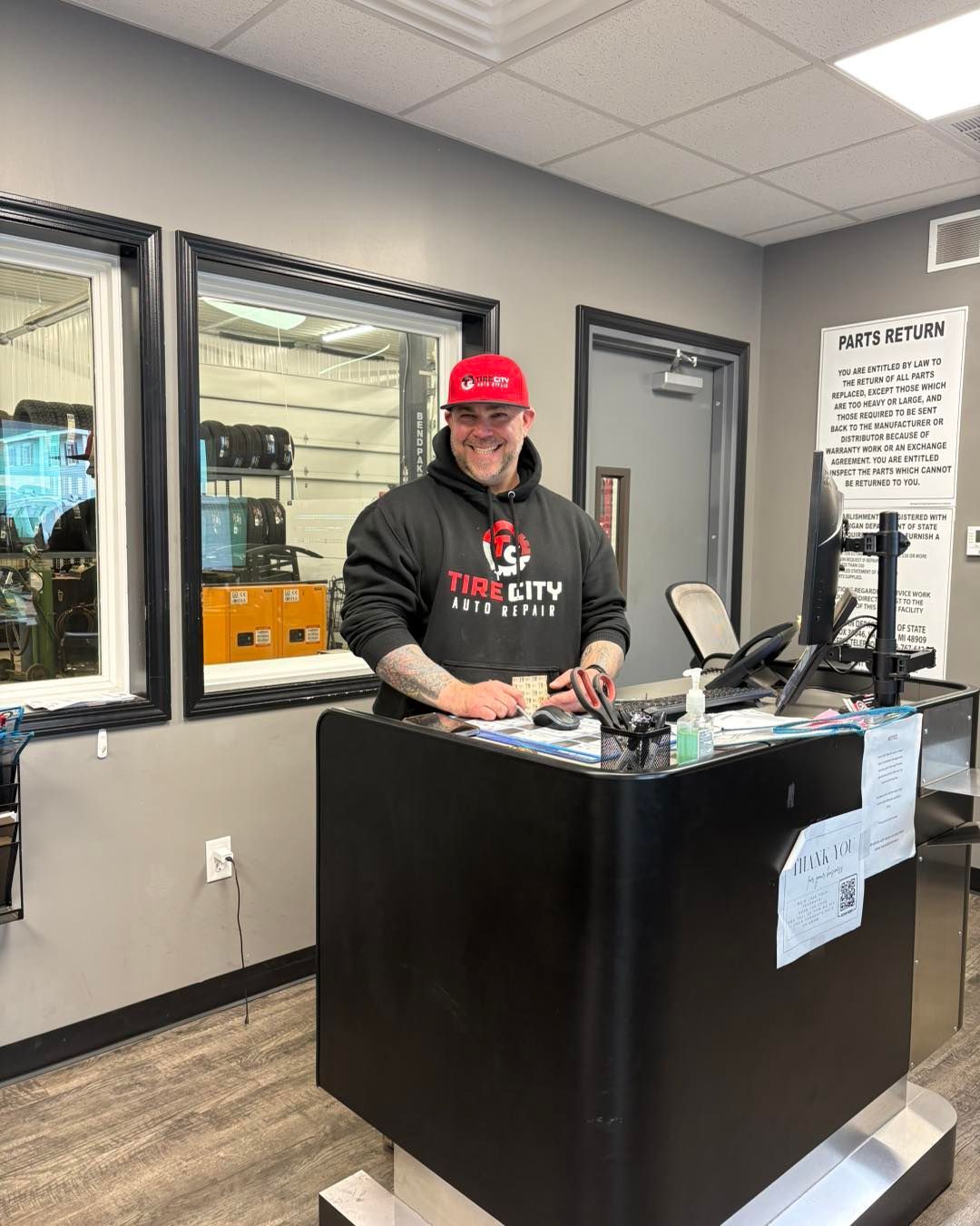 Team Member Behind Counter | Tire City Auto Repair