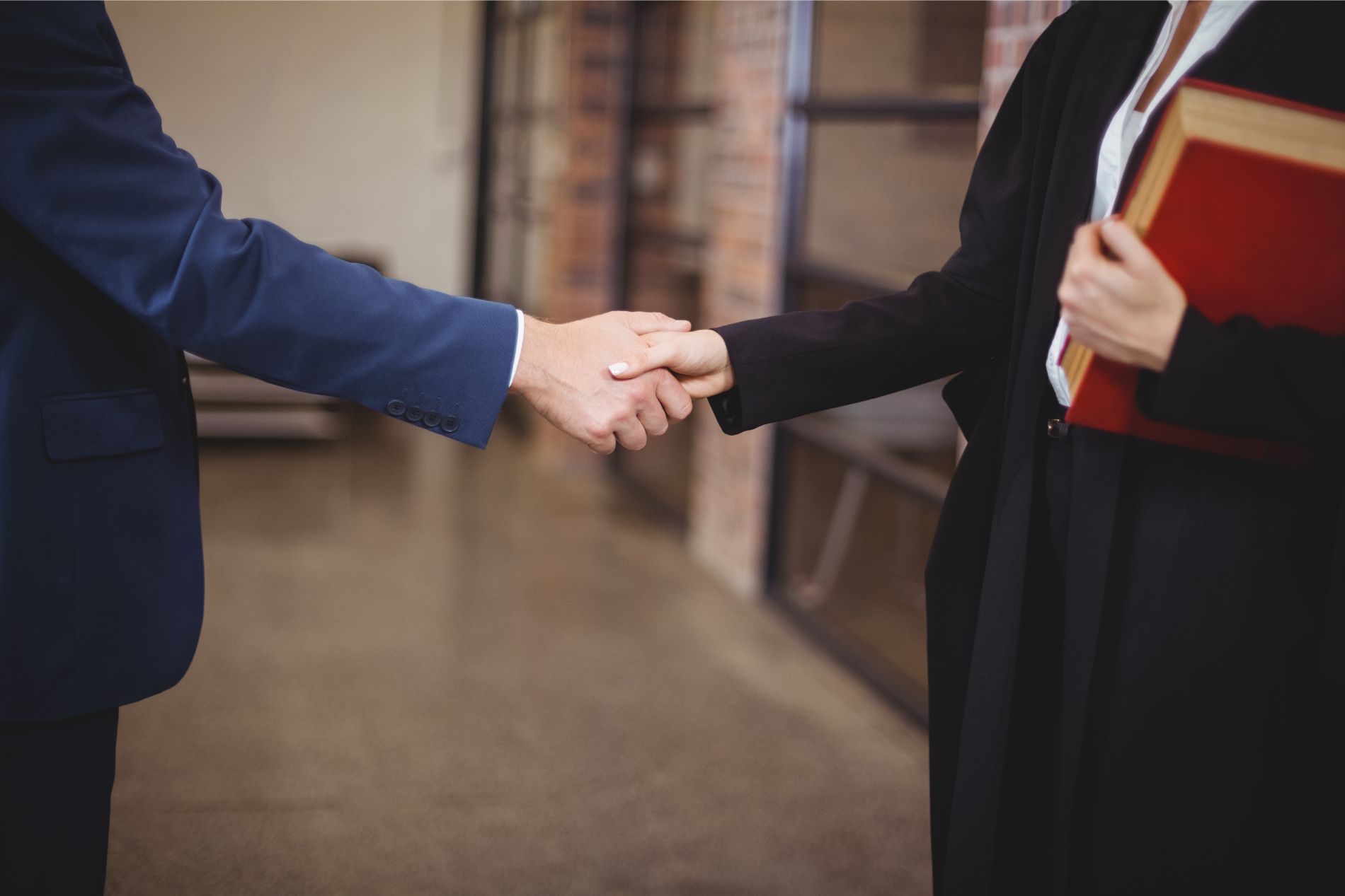 an attorney shaking hands with a client