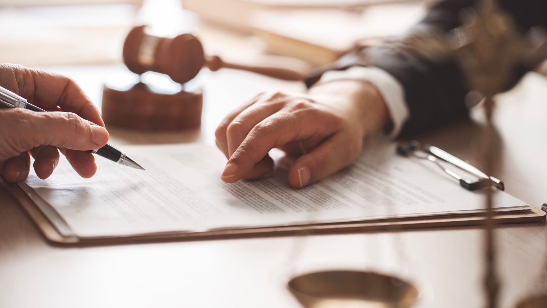 Lawyer pointing at a legal document.