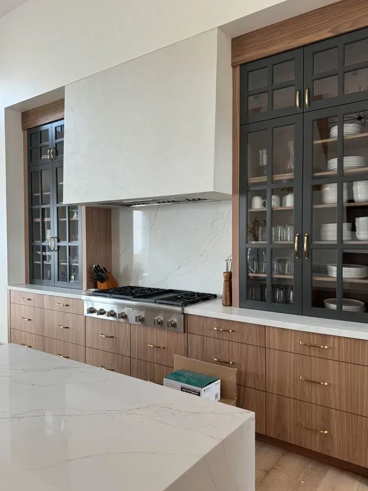 A kitchen with stainless steel appliances and wooden cabinets