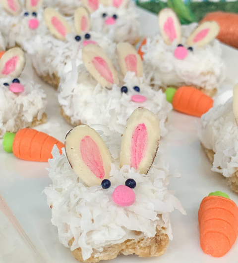 granola bars topped with coconut flakes and decorated to look like bunnies