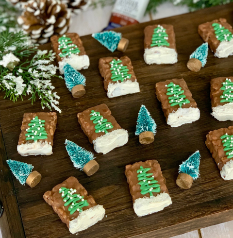 fudge dipped chocolate chip chewy granola bars decorated with green christmas trees, sprinkles and white candy chocolate