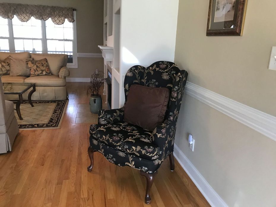 A living room with a chair and a couch