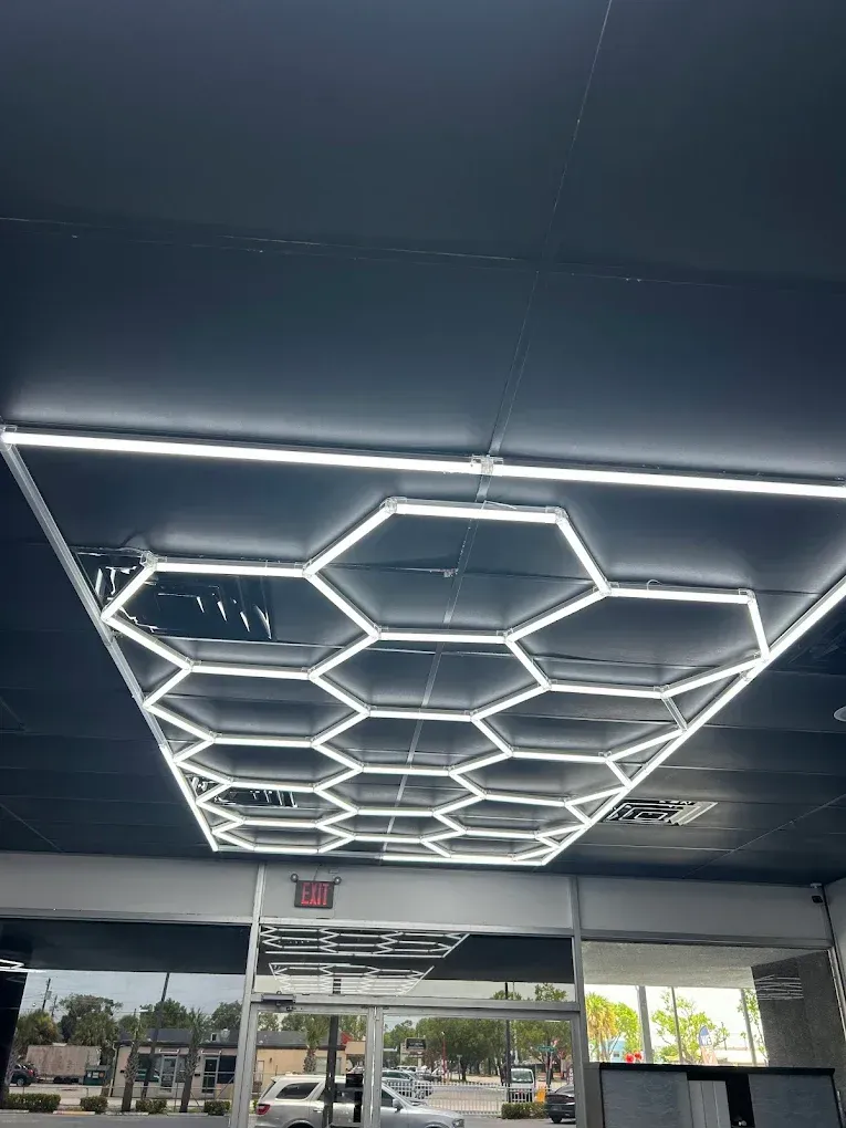 A ceiling with a honeycomb pattern of lights on it.