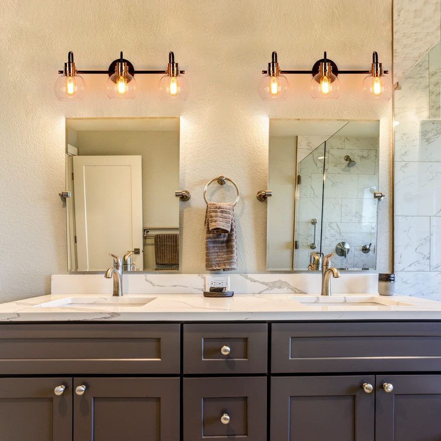 A bathroom with two sinks and two mirrors.
