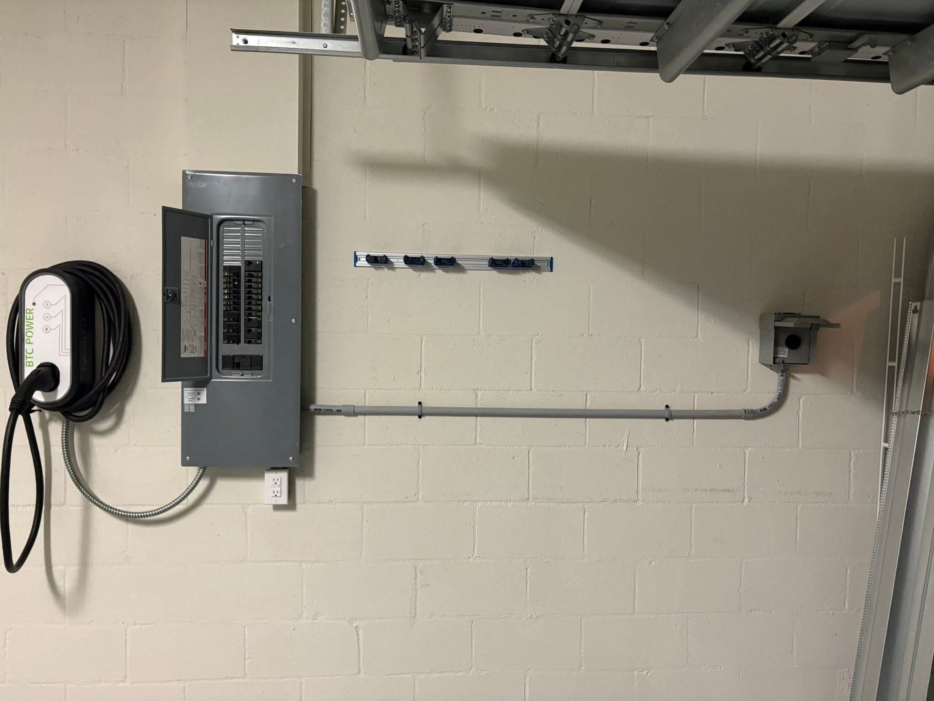 Spacious bathroom with marble floors, a white tub, and walk-in shower, and a large window.