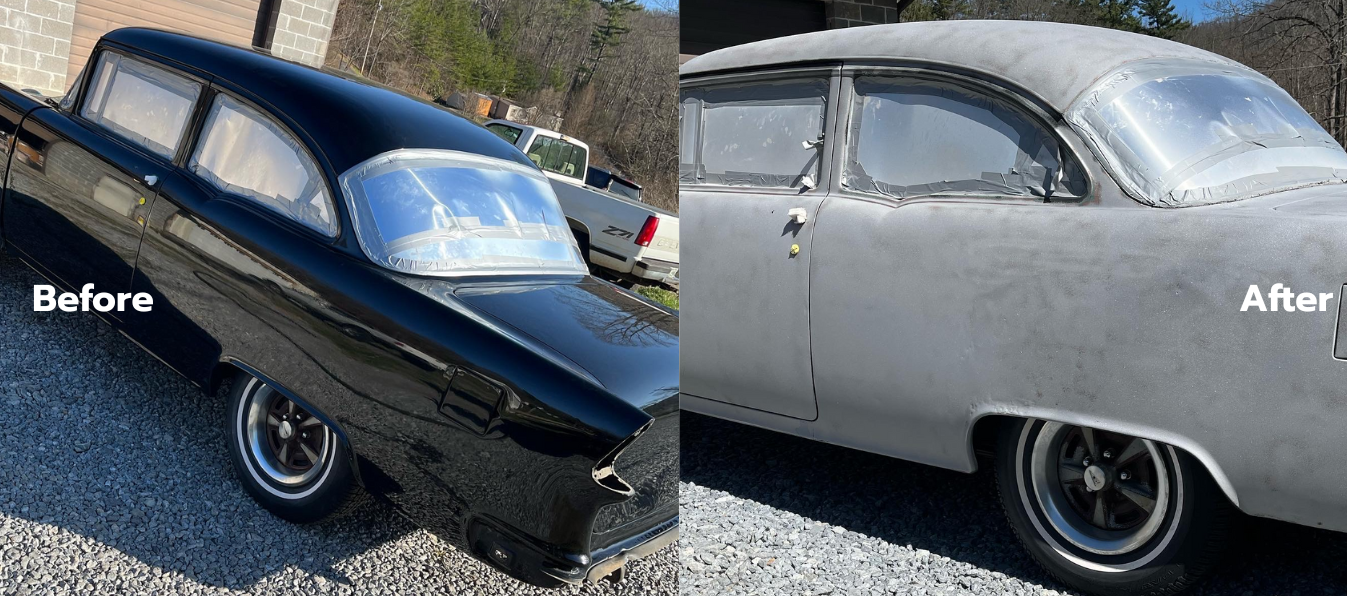 A man wearing a green helmet is sandblasting a car.