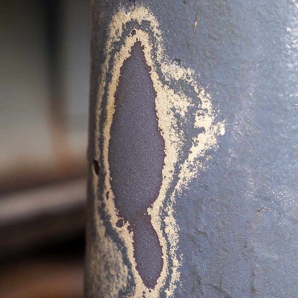 A close up of a piece of metal with a hole in it