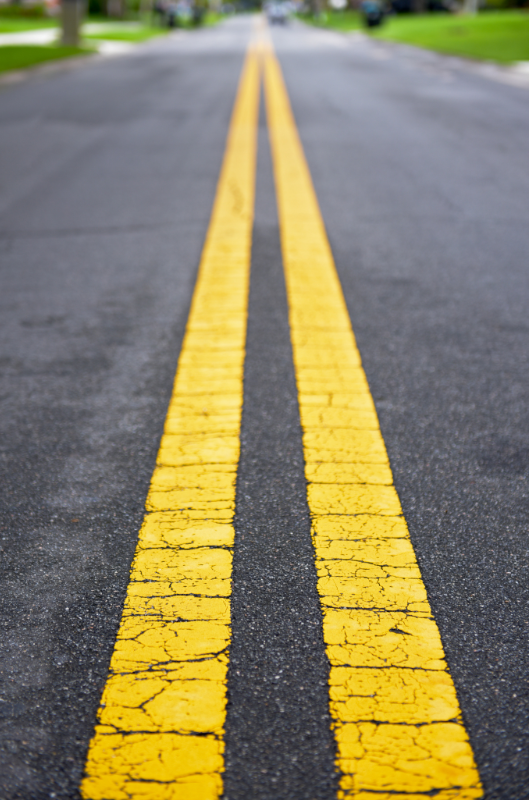 A road with two yellow lines on it