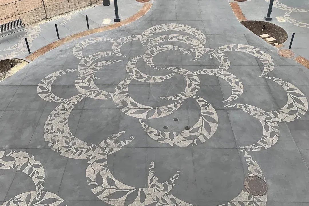 A concrete floor with a pattern of circles on it.