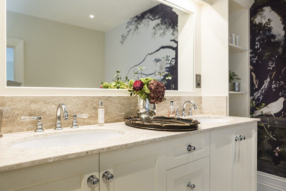 Dual bathroom sinks with large mirror