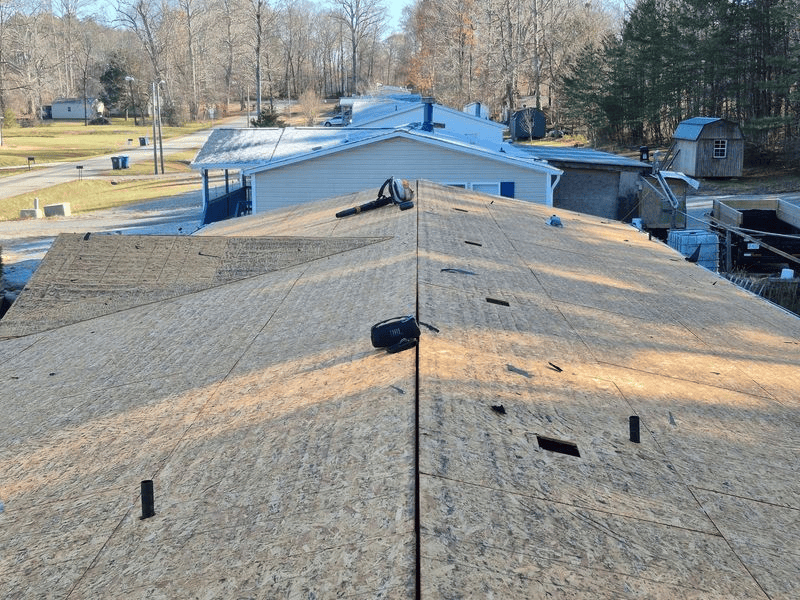 View from a roof showing new plywood and equipment