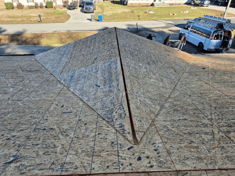Roof under construction with exposed wood panels