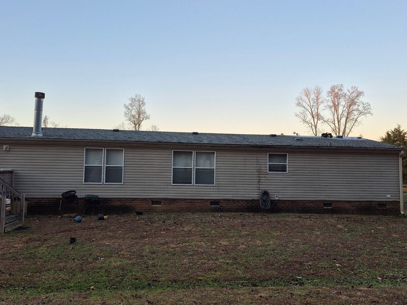 Mobile home exterior with tan siding