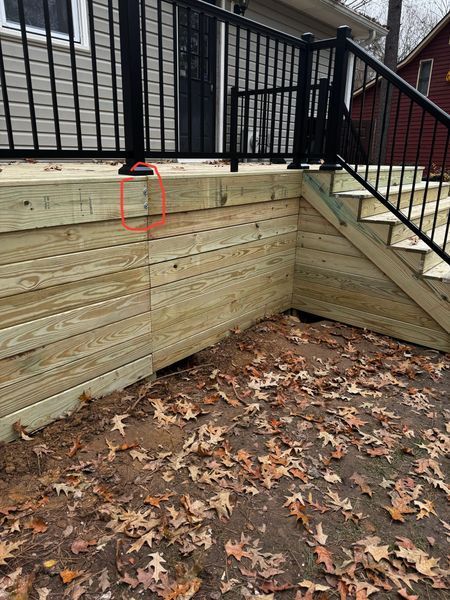 Wooden deck with black railing