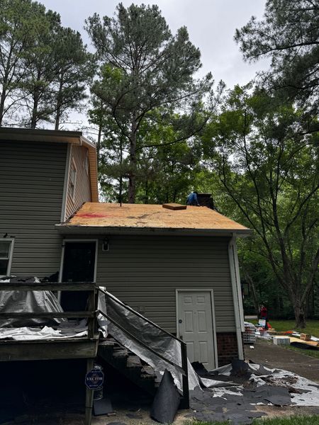 House with roofing construction in progress
