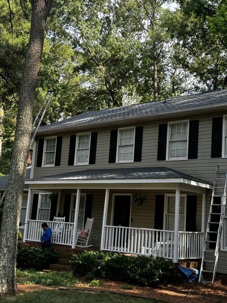 Two-story house with a porch and shutters