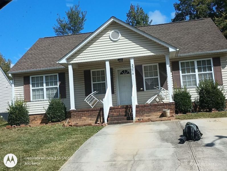 Tan house with a brown roof