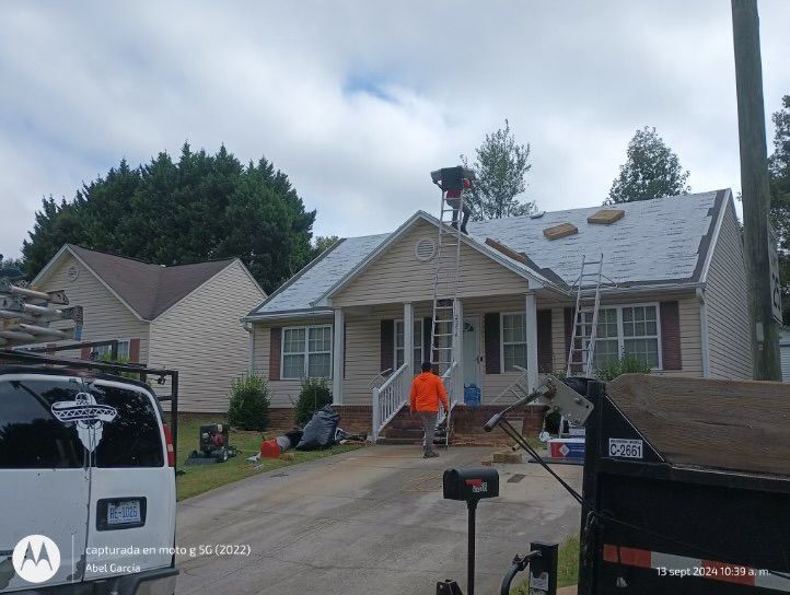 Roofers working on a house