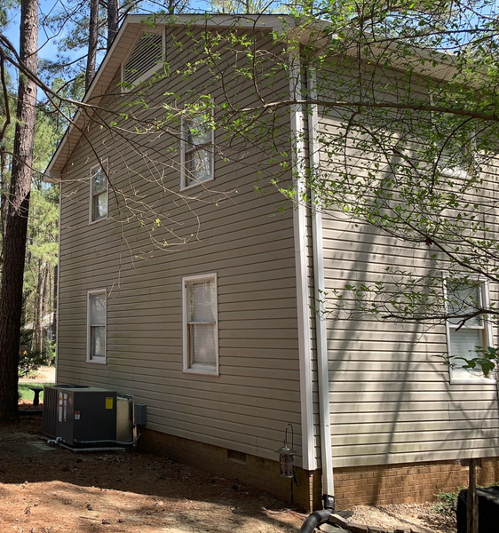 Two-story house with light siding