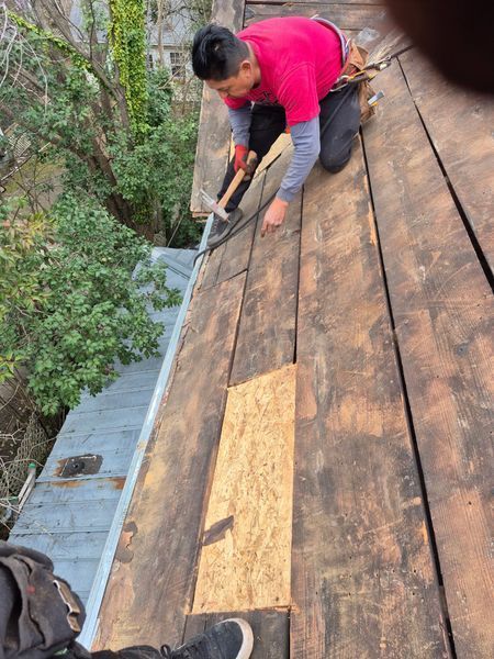Roofer on a wooden roof
