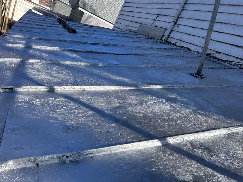 Lead roof with visible seams and a support pole