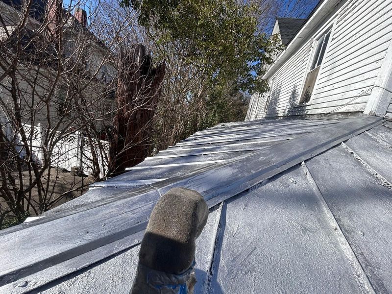 Close-up of a weathered white roof 