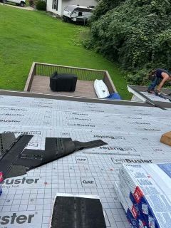 A roof in progress with a person working