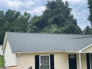 Yellow house with gray roof