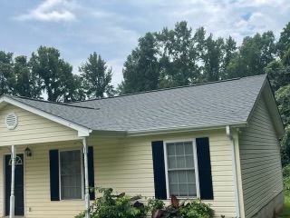 Yellow house with a gray roof