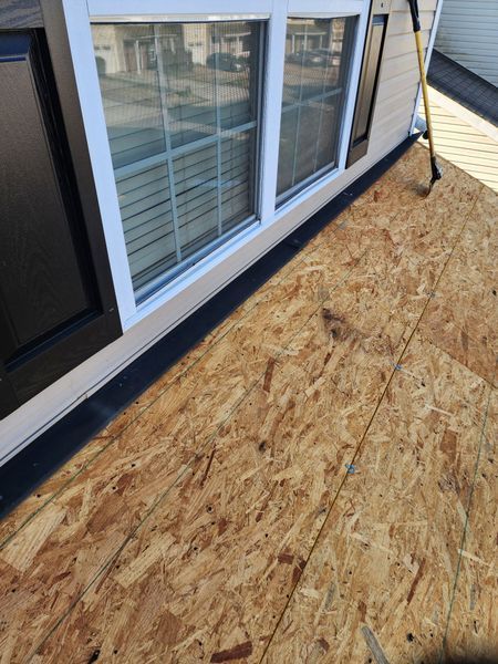 OSB roof deck next to a white window