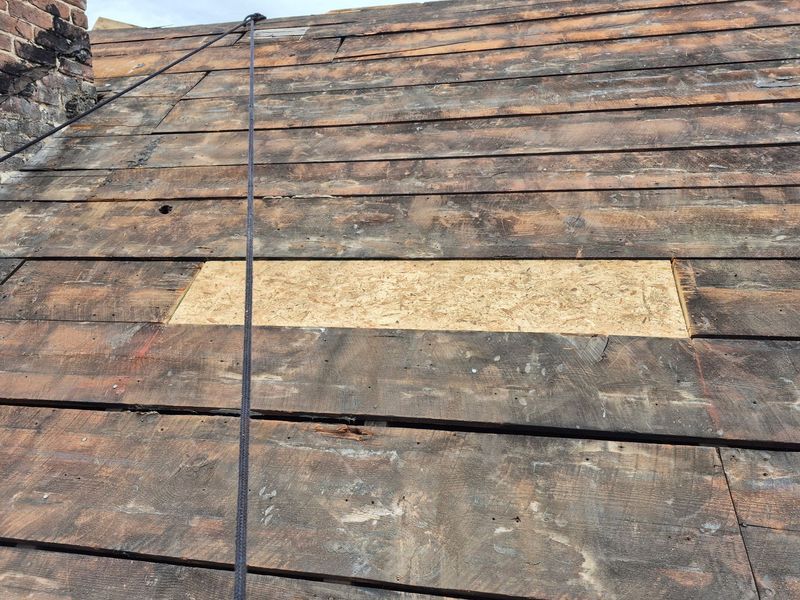 Roof with damaged tiles