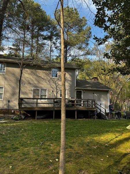 Back of a house with a wooden deck