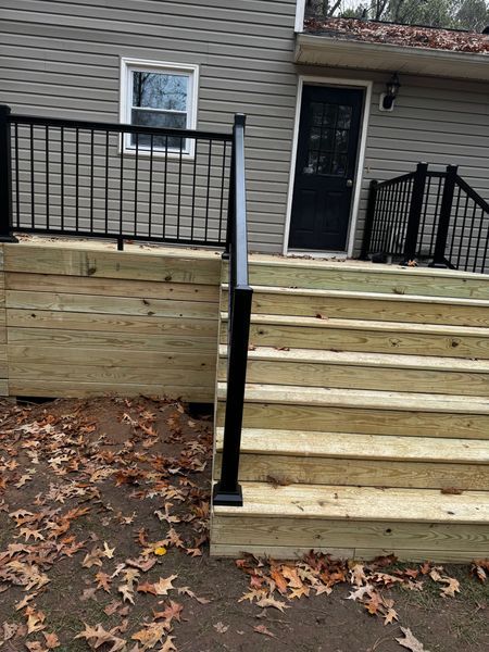 Wooden stairs leading to a back door