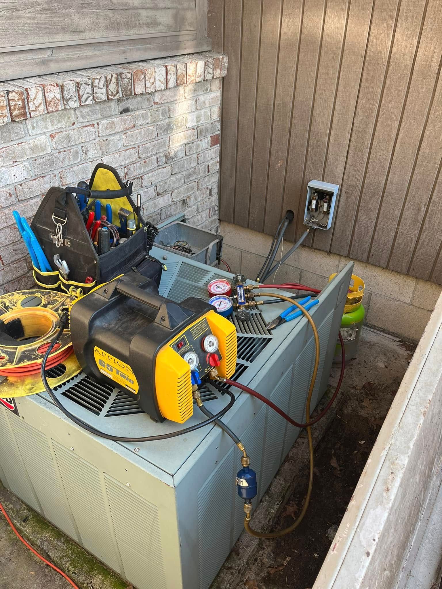 A bunch of appliances are sitting on top of each other in a room.