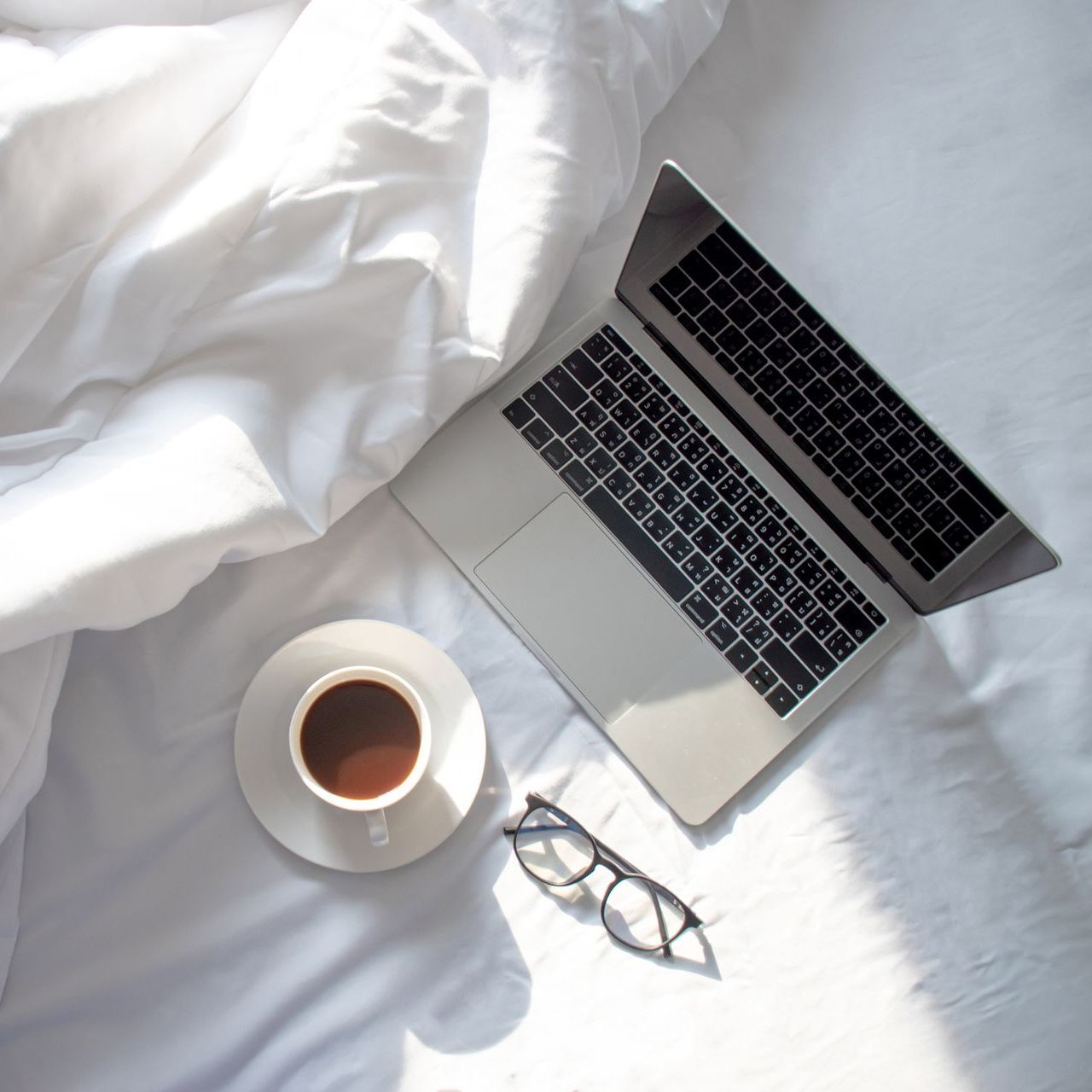 Photo of a laptop and coffee